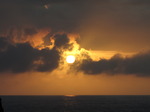 SX07436 Sun shining through clouds at dusk.jpg
